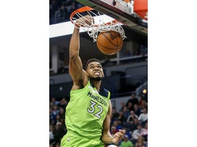 Minnesota Timberwolves center Karl-Anthony Towns (32) dunks against the New Orleans Pelicans in the second quarter of an NBA basketball game Saturday, Jan. 6, 2018, in Minneapolis.