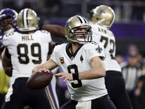 New Orleans Saints quarterback Drew Brees (9) throws against the Minnesota Vikings during the first half of an NFL divisional football playoff game in Minneapolis, Sunday, Jan. 14, 2018.