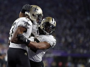 New Orleans Saints wide receiver Michael Thomas (13) celebrates his touchdown with running back Mark Ingram (22) during the second half of an NFL divisional football playoff game against the Minnesota Vikings in Minneapolis, Sunday, Jan. 14, 2018.