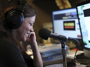 In an Aug. 28, 2017 photo, Michele Tafoya, sideline reporter for NBC Sunday Night Football,  works from her home studio in Edina, Minn., on the morning radio show lives in Edina with her husband and two children. She recently joined Tom Barnard on the popular KQ Morning Show.