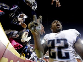 Tennessee Titans running back Derrick Henry celebrates with fans after the team's NFL wild-card playoff football game against the Kansas City Chiefs on Saturday, Jan. 6, 2018, in Kansas City, Mo. The Titans won 22-21.