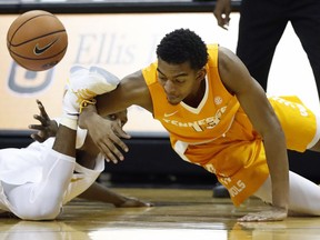 Tennessee's Jalen Johnson, right, and Missouri's Terrence Phillips scramble for a loose ball during the first half of an NCAA college basketball game Wednesday, Jan. 17, 2018, in Columbia, Mo.