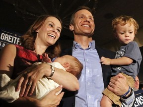 In this Aug. 2, 2016, photo, Eric Greitens poses with his wife, Sheena and his two sons Jacob and Joshua at a watch party at the Doubletree Hotel in Chesterfield, Mo., after he was declared the winner in the Republican Governor primaries. Greitens has acknowledged being "unfaithful" in his marriage but denies allegations that he blackmailed a woman to stay quiet, following a bombshell news report that overshadowed his annual address to the Legislature on Jan. 10, 2018.