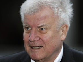 Bavarian state governor Horst Seehofer arrives for a meeting with German Chancellor Angela Merkel and Social Democratic chairman Martin Schulz for talks about a new German government in Berlin, Wednesday, Jan. 3, 2018.