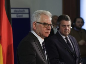 German Foreign Minister Sigmar Gabriel, right, and his Polish counterpart Jacek Czaputowicz, left, brief the media after a meeting at the foreign ministry in Berlin, Wednesday, Jan. 17, 2018.