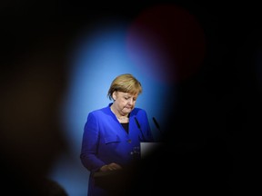 German Chancellor Angela Merkel attends a joint statement after the exploratory talks between Merkel's conservative bloc and the Social Democrats on forming a new German government in Berlin, Germany, Friday, Jan. 12, 2018.