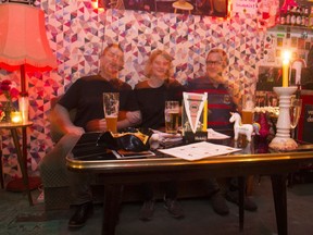 In this Jan. 11, 2018 photo from left: Torben Bertram, Patricia Bernreuther and Norbert Buddendick sway to music while sitting down on a sofa during a training session of Germany's first sofa sports association at the 'Radio - The Label Bar' in Berlin.