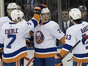 New York Islanders center Anthony Beauvillier (72) celebrates with his team mates after scoring a goal during the first period of an NHL hockey game against the New York Rangers, Saturday, Jan. 13, 2018, at Madison Square Garden in New York.