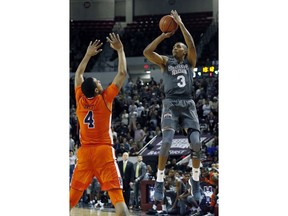 Mississippi State guard Xavian Stapleton (3) attempts a shot in front of Auburn forward Chuma Okeke (4) during the first half of an NCAA college basketball game in Starkville, Miss., Saturday, Jan. 13, 2018.