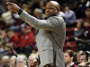 Arkansas head coach Mike Anderson gestures to his team during the first half of their NCAA college basketball game against Mississippi State in Starkville, Miss., Tuesday, Jan. 2, 2018.