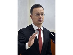 Hungarian Minister of Foreign Affairs and Trade, Peter Szijjarto, holds a press conference in response to the recent remarks by Romanian Prime Minister Mihai Tudose in the Ministry of Foreign Affairs and Trade in Budapest, Hungary, Friday, Jan. 12, 2018. Hungary's foreign minister says provocative comments by Romania's prime minister about autonomy efforts by Szeklers, a group of ethnic Hungarians in Romania, are "totally unacceptable" and "unworthy of the 21st century."