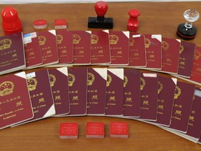 Sept. 15, 2015 Chinese passports and stamps seized by Canada Border Services Agency.