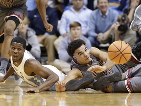 North Carolina's Kenny Williams, left, and Boston College's Jerome Robinson chase the ball during the first half of an NCAA college basketball game in Chapel Hill, N.C., Tuesday, Jan. 9, 2018.