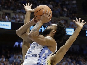 North Carolina's Joel Berry II (2) drives to the basket while Georgia Tech's Brandon Alston defends during the first half of an NCAA college basketball game in Chapel Hill, N.C., Saturday, Jan. 20, 2018.