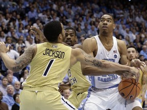 Georgia Tech's Tadric Jackson (1) guards North Carolina's Garrison Brooks during the first half of an NCAA college basketball game in Chapel Hill, N.C., Saturday, Jan. 20, 2018.