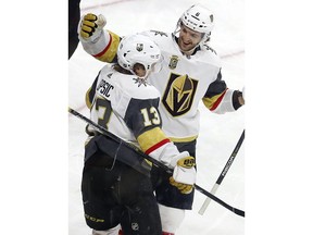Vegas Golden Knights' Brendan Leipsic (13) is congratulated on his goal by teammate Colin Miller (6) during the third period of an NHL hockey game against the Carolina Hurricanes, Sunday, Jan. 21, 2018, in Raleigh, N.C.