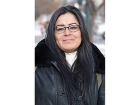 FILE - In this Dec. 8, 2017, file photo, Red Fawn Fallis, of Denver, stands outside the federal courthouse in Bismarck, N.D. Fallis, accused of shooting at law officers in October 2016 during protests in North Dakota against the Dakota Access oil pipeline, will not receive more information about an FBI informant she alleges seduced her and owned the gun. She is to stand trial in federal court in Fargo beginning Jan. 29, 2018. No one was injured in the shooting,