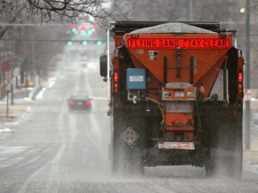 FILE - In this Jan. 16, 2017 file photo, a city truck spreads salt on Q Street in Lincoln, Neb. Scientists are starting to raise concerns about road salt's impact on the environment, especially drinking water, because lakes and streams near roads are showing elevated levels of sodium and chloride.