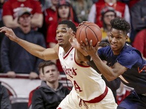 Illinois' Trent Frazier (1) and Nebraska's James Palmer Jr. (24) go for a rebound during the first half of an NCAA college basketball game in Lincoln, Neb., Monday, Jan. 15, 2018.