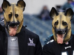 Philadelphia Eagles fans dressed as underdogs watch as players start to warm up before the NFL football NFC championship game against the Minnesota Vikings Sunday, Jan. 21, 2018, in Philadelphia.