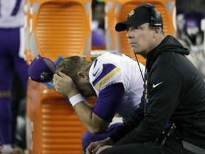 Minnesota Vikings quarterback Case Keenum, left, reacts on the bench beside offensive coordinator Pat Shurmur during the second half of the NFL football NFC championship game against the Philadelphia Eagles, in Philadelphia.