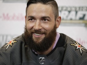 Vegas Golden Knights defenceman Deryk Engelland poses for photos after being selected in the NHL expansion draft.