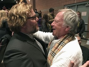 In a Jan. 22, 2017 photo, Jan Lewandowski, right, better known as Jan Lewan, embraces actor and comedian Jack Black at the premiere of "The Polka King" at the Sundance Film Festival in Park City, Utah. Lewandowski's rise and fall is the subject of "The Polka King," a comedy starring Black as the polka bandleader convicted of fleecing fans of millions of dollars.