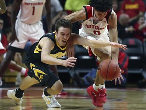 Iowa' Nicholas Baer, left, and Rutgers' Geo Baker (0) battle for a loose ball during an NCAA college basketball game, Wednesday, Jan. 17, 2018 in Piscataway, N.J.