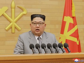 In this photo provided by the North Korean government, North Korean leader Kim Jong Un delivers his New Year's speech at an undisclosed place in North Korea Monday, Jan. 1, 2018. Kim said Monday the United States should be aware that his country's nuclear forces are now a reality, not a threat.
