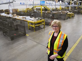 Carla Qualtrough, Minister of Public Services and Procurement, walks through the mail room after making an announcement regarding the vision for renewal at Canada Post, providing high quality service for Canadians at the Canada Post Gateway location in Mississauga, Ont., on Wednesday, January 24, 2018.