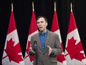 Minister of Finance Bill Morneau speaks to the media before the Liberal cabinet retreat in London, Ont., on Friday, January 12, 2018. Morneau concedes that Canada's red-hot economy is likely to slow this year.