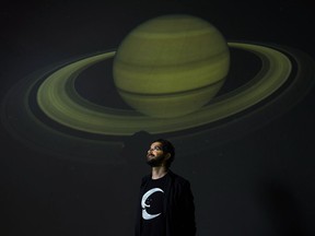 Astrophysicist Matt Russo poses for a photograph at the University of Toronto's portable dome theatre/planetarium in Toronto on Wednesday, January 24, 2018. Russo connects people to the universe through music.THE CANADIAN PRESS/Nathan Denette