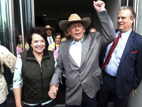 Cliven Bundy walks out of federal court with his wife Carol on Monday, Jan. 8, 2018, in Las Vegas, after a judge dismissed criminal charges against him and his sons accused of leading an armed uprising against federal authorities in 2014.