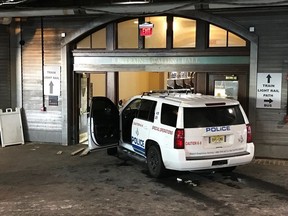 A police K-9 SUV sits on the scene after a person crashed it into the doors of the waiting room at the Hoboken, N.J., rail terminal Monday, Jan. 8, 2018.