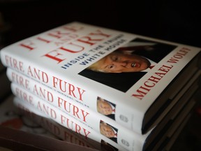 FILE - In this Jan. 5, 2018 file photo, copies of the book "Fire and Fury: Inside the Trump White House" by Michael Wolff are displayed at Barbara's Books Store in Chicago.  Wolff's "Fire and Fury" is well on its way to becoming one of the top selling nonfiction books in recent years.  The tell-all about the Trump administration book has sold more than 1.7 million copies in the combined formats of hardcover, e-books and audio, publisher Henry Holt and Company told The Associated Press on Wednesday, Jan. 24. Published less than 3 weeks ago, the book remains No. 1 on Amazon.com and other lists.