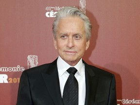 FILE - In this Feb. 26, 2016 file photo, U.S actor Michael Douglas arrives at the 41st French Cesar Awards Ceremony, in Paris. A woman who worked for  Douglas in the late 1980s says he fondled himself in front of her, an allegation the actor has vigorously denied. Journalist and author Susan Braudy appeared Friday, Jan. 19, 2018 on NBC's "Today" show. Earlier this month, Douglas said he anticipated an upcoming report containing allegations and called it a "complete lie, fabrication."