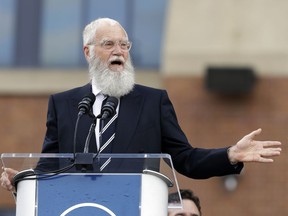 FILE - In this Saturday, Oct. 7, 2017, file photo, David Letterman speaks during the unveiling of a Peyton Manning statue outside of Lucas Oil Stadium, in Indianapolis.  Letterman has lined up former president Barack Obama to be his first guest when he returns to a TV talk show later this month. Obama will join Letterman on Jan. 12, 2018 for the launch of the new "My Next Guest Needs No Introduction with David Letterman" on Netflix.