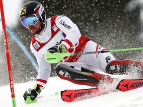 FILE - In this Jan. 7, 2018, file photo, Austria's Marcel Hirscher competes during an alpine ski, men's World Cup slalom in Adelboden, Switzerland. Hirscher is the only man with six World Cup overall titles _ all in a row, too. He's won four world championship crowns and 51 World Cup races, just three away from matching the total of fellow Austrian Hermann Maier. It's an impressive resume with just one glaring omission _ an Olympic gold medal.