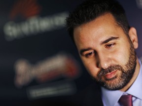 FILE - In this Nov. 13, 2017, file photo, Alex Anthopoulos speaks to reporters following a news conference introducing him as the new general manager of the Atlanta Braves baseball team in Atlanta. Anthopoulos says he hasn't ruled out signing a free agent but says he doesn't want to block prospects in the team's rebuilding process by adding a long-term contract.