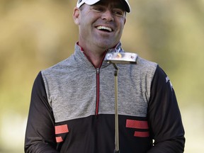 FILE - In this Oct. 28, 2017, file photo, Ryan Armour laughs after carding a birdie on the 16th during the third round of the Sanderson Farms Championship golf tournament in Jackson, Miss. Armour took nearly two decades before getting his first win, which made him eligible for this week's Sentry Tournament of Champions in Hawaii.
