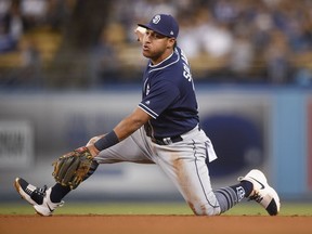FILE - In this Sept. 25, 2017, file photo, San Diego Padres third baseman Yangervis Solarte holds on to the ball after catching a line drive hit by Los Angeles Dodgers' Cody Bellinger during the fifth inning of a baseball game in Los Angeles.  The Toronto Blue Jays acquired Solarte from the Padres on on Saturday, Jan 6, 2018,  for prospects Edward Olivares and Jared Carkuff.