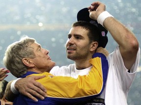 FILE - In this Jan. 30, 2000, file photo, St. Louis Rams quarterback Kurt Warner, right, gets a hug from Rams coach Dick Vermeil after the Rams defeated the Tennessee Titans 23-16 to win Super Bowl XXXIV in Atlanta. Vermeil hada successful seven-year run as coach of Philadelphia from 1976-82, taking the Eagles to their first Super Bowl following the 1980 season. But Vermeil burned out of coaching and stepped away after the 1982 season. Vermeil then launched a successful broadcast career before finally going back to the sidelines in 1997 with the Rams. St. Louis won just nine games his first two years before breaking through with the Super Bowl title in the 1999 season.