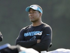 FILE - In this Aug. 3, 2015, file photo, Carolina Panthers assistant head coach Steve Wilks watches players warm up during NFL football team's training camp in Spartanburg, S.C. Wilks is the new head football coach of the Arizona Cardinals. The Cardinals announced Monday, Jan. 22, 2018, that the 48-year-old Carolina Panthers defensive coordinator had agreed to a four-year contract with a team option for a fifth.