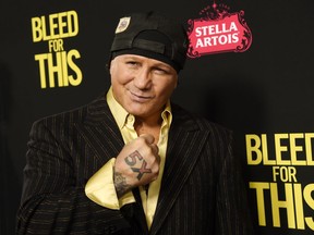 FILE - In this Nov. 2, 2016, file photo, former boxer Vinny Paz, subject of the film "Bleed for This," poses at the premiere of the film in Beverly Hills, Calif. Retired boxing champion Vinny Paz, whose comeback story after a car crash was dramatized in the 2016 film "Bleed for This," has been accused of attacking a Rhode Island man and sending him to the hospital. Providence police say they were called to a home early Tuesday morning, Jan . 2, 2018. They say when officers arrived, witnesses told them Paz had accused a friend of stealing $16,000 and then assaulted him.