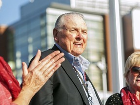 FILE - In this Sept. 13, 2014, file photo, Washington State alumnus Keith Jackson smiles after raising the Cougar flag before the start of an NCAA college football game against Portland State at Martin Stadium in Pullman, Wash. Jackson, the down-home voice of college football during more than five decades as a broadcaster, died Friday, Jan. 12, 2018. He was 89.