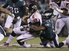 FILE - In this Jan. 13, 2018, file photo, Philadelphia Eagles' Nigel Bradham (53) tackles Atlanta Falcons' Matt Ryan (2) during an NFL divisional playoff football game, in Philadelphia. One team has a suffocating defense. The other has the NFL's No. 1 unit. Defense should win at least the NFC championship.