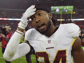 FILE - In a Sunday Oct. 30, 2016, file photo, Washington Redskins cornerback Josh Norman (24) leaves the field after an NFL Football game against Cincinnati Bengals at Wembley Stadium in London. The NFL has established a player-owner committee focusing on social and racial justice initiatives. The league also said Tuesday, Jan. 23, 2018, it is beginning a "Let's Listen Together" campaign that includes digital content and commercials highlighting player-led work on equality issues. That platform will include social media support and letters from players and owners. Owners on the committee are Arizona's Michael Bidwill, Atlanta's Arthur Blank, Jacksonville's Shahid Khan, Cleveland's Jimmy Haslam and Miami's Stephen Ross. Current players Josh McCown, Josh Norman, and Kelvin Beachum, Pro Football Hall of Famer Aeneas Williams and former player Anquan Boldin are on the committee.