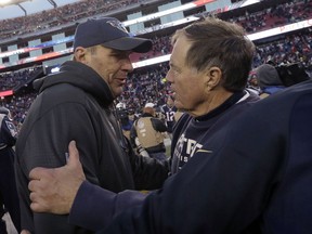 FILE - In this Dec. 20, 2015, file photo, Tennessee Titans then-interim head coach Mike Mularkey, left, speaks to New England Patriots head coach Bill Belichick after their NFL football game, in Foxborough, Mass. The Titans and Patriots play in a divisional playoff game on Saturday, Jan. 13, 2018, in Foxborough, Mass.