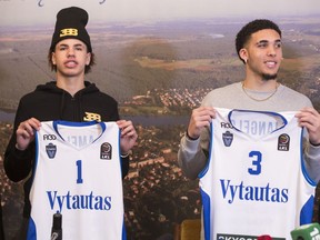 In this file photo from Friday, Jan. 5, 2018, LiAngelo Ball, right, and his brother, LaMelo, display their shirts after signing with Lithuanian team BC Prienai-Birstonas Vytautas. It was announced Thursday the brothers' time in Lithuania will come to an end immediately.