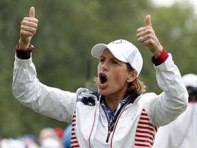 FILE - In this Aug. 19, 2017, file photo, United States captain Juli Inkster gestures to the gallery during a foursomes match in the Solheim Cup golf tournament, Saturday, Aug. 19, 2017, in West Des Moines, Iowa. Inkster is the first American to be Solheim Cup captain three times. Now she'd like the distinction of being the first American captain with three victories.